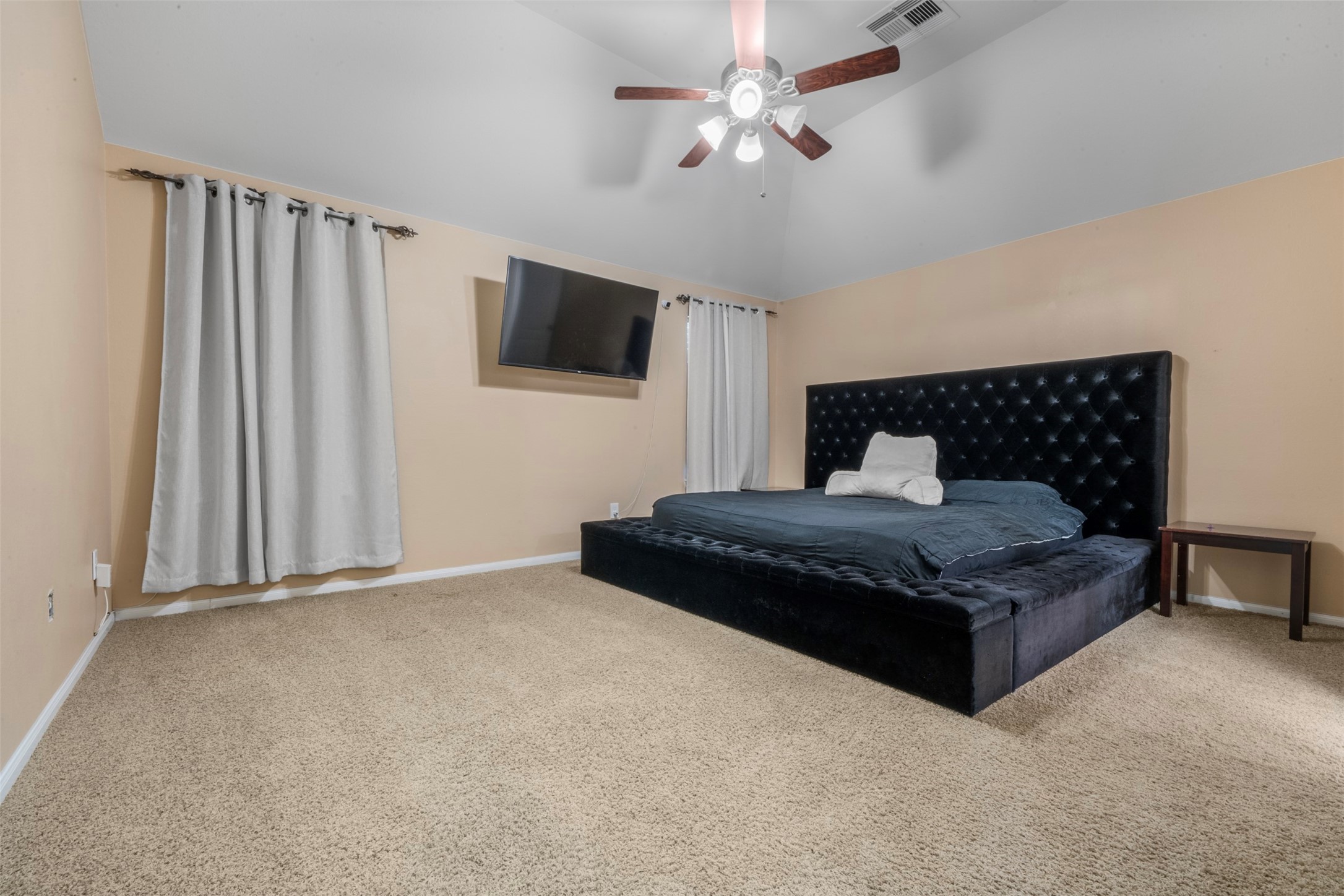 314 Gulf Winds Drive Bacliff, TX 77518 - Photo 12 of 24 a bedroom with a large bed and a tv