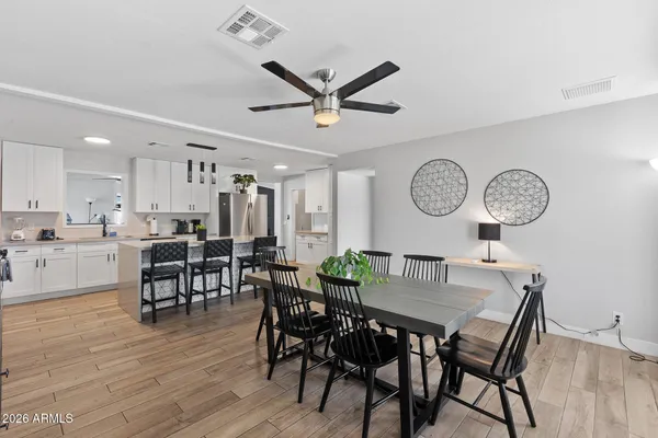 a view of a dining room with furniture and wooden floor