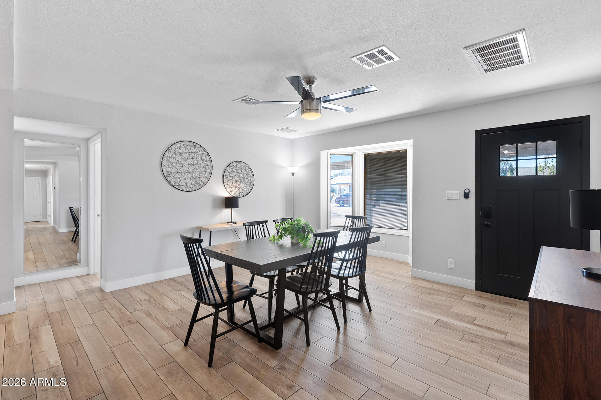 726 West 19th Street Tempe, AZ 85281 - Photo 11 of 40 a view of a dining room with furniture and wooden floor