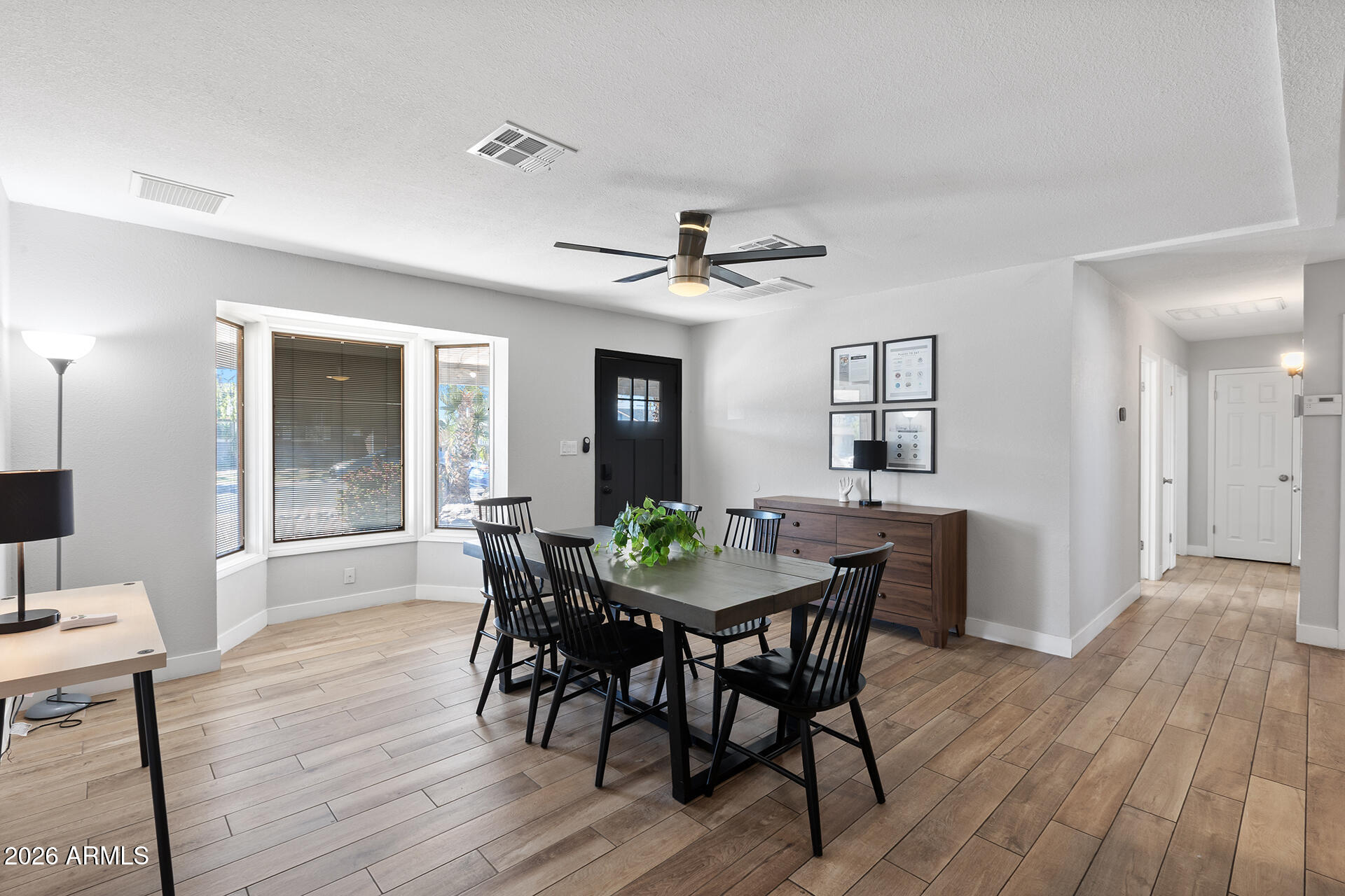 726 West 19th Street Tempe, AZ 85281 - Photo 12 of 40 a view of a dining room with furniture and wooden floor
