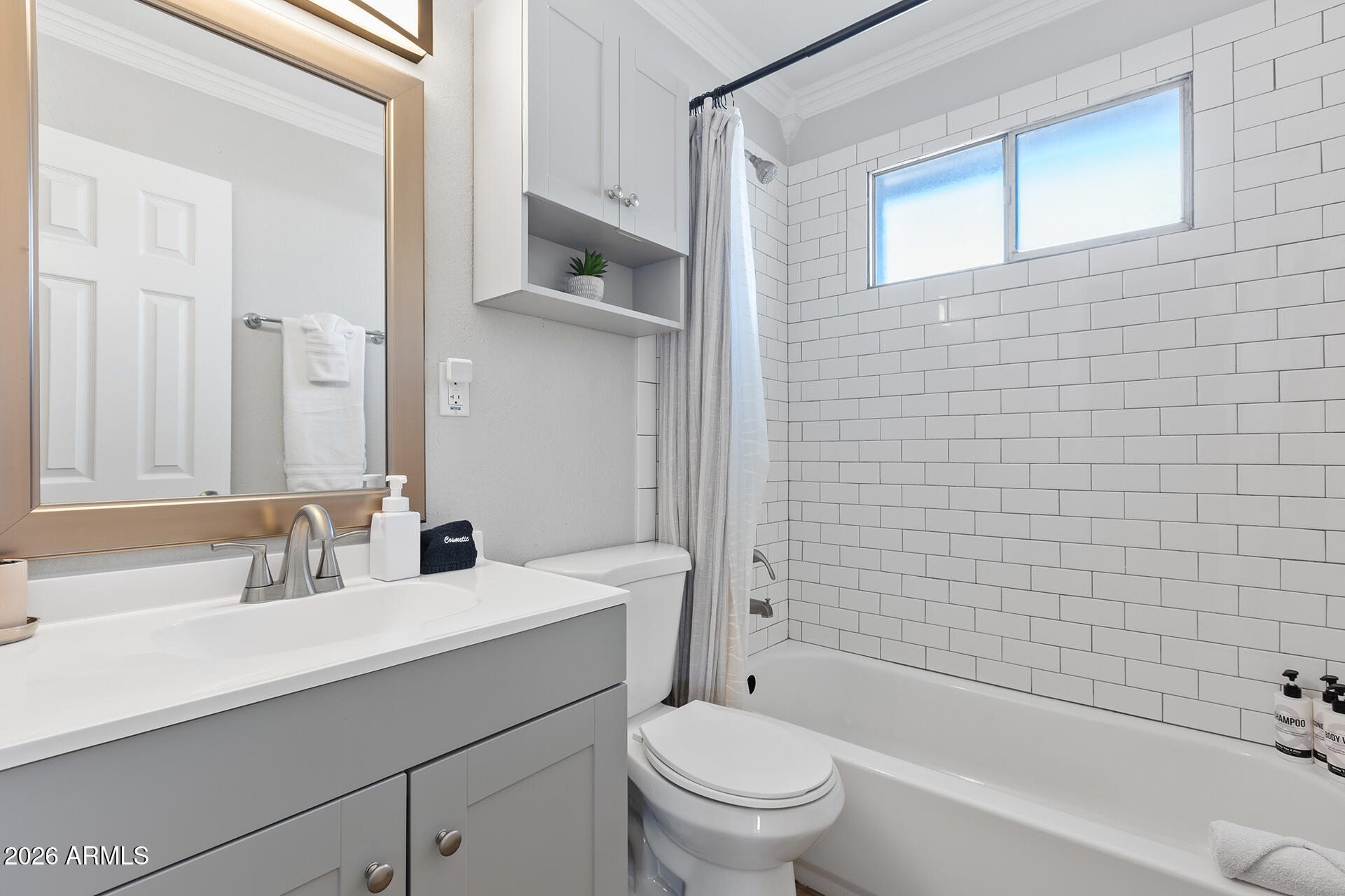 726 West 19th Street Tempe, AZ 85281 - Photo 14 of 40 a bathroom with a sink a toilet and shower