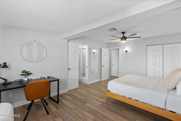 a bedroom with a bed and a window