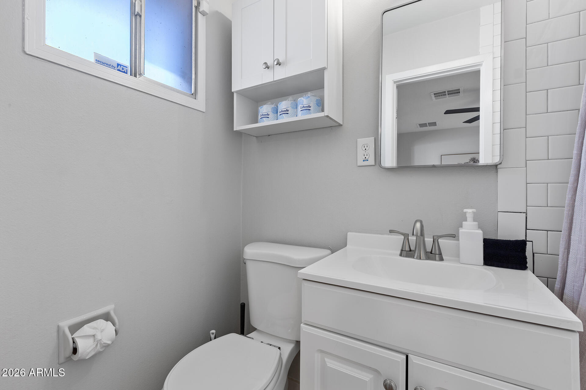 726 West 19th Street Tempe, AZ 85281 - Photo 17 of 40 a bathroom with a toilet sink vanity and mirror