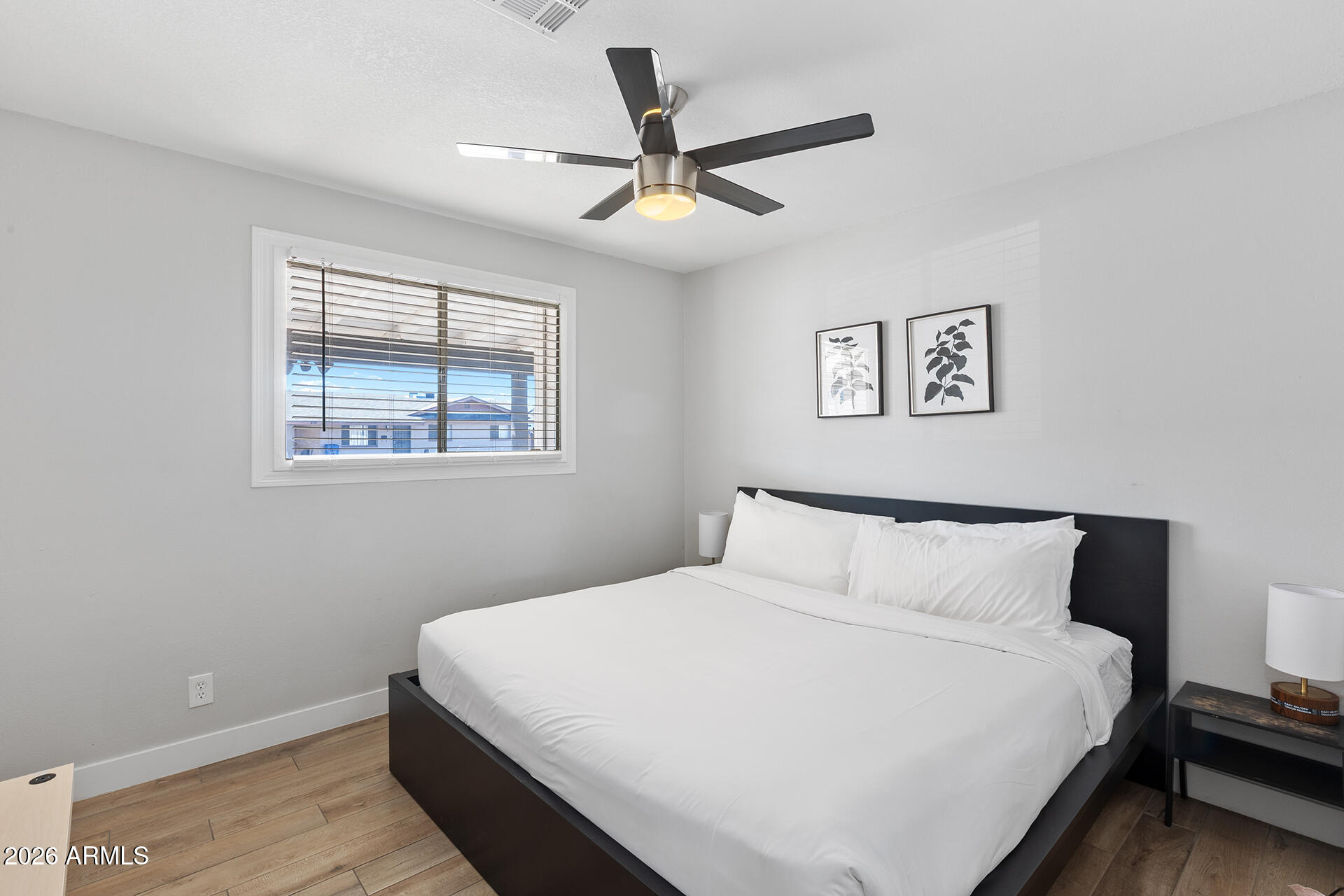 726 West 19th Street Tempe, AZ 85281 - Photo 19 of 40 a bedroom with a bed and a window