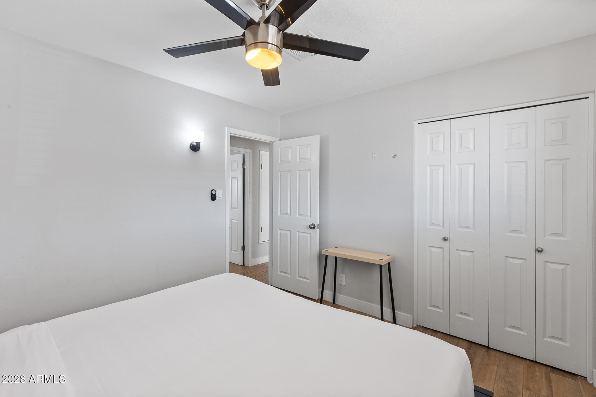 726 West 19th Street Tempe, AZ 85281 - Photo 20 of 40 a bedroom with a bed and a chandelier