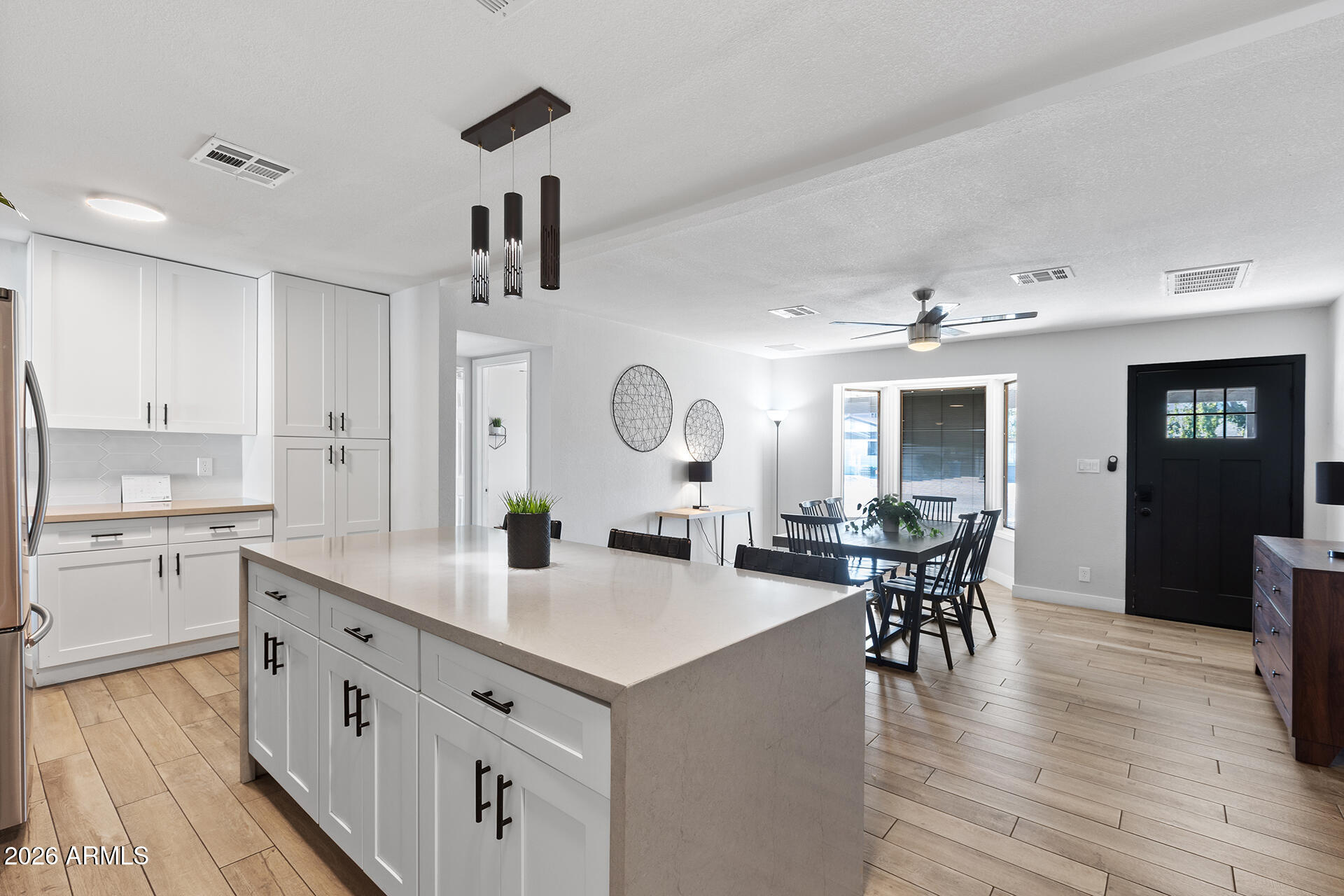 726 West 19th Street Tempe, AZ 85281 - Photo 26 of 40 a large kitchen with lots of counter space and furniture