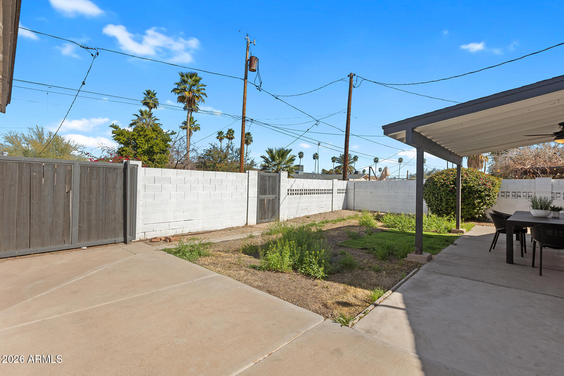 726 West 19th Street Tempe, AZ 85281 - Photo 38 of 40 a view of a backyard with table and chairs potted plants
