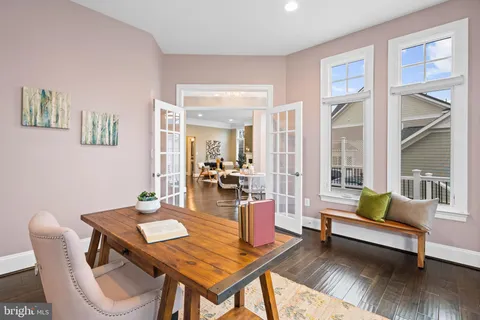a view of a patio with table and chairs with wooden floor and fence