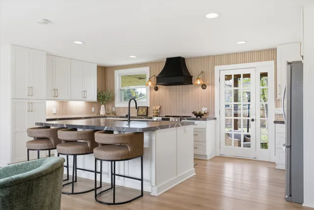 a kitchen with a sink cabinets and window