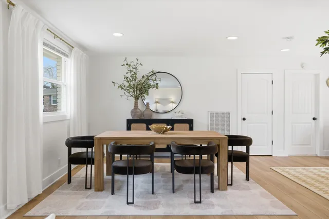 a view of a dining room with furniture and window