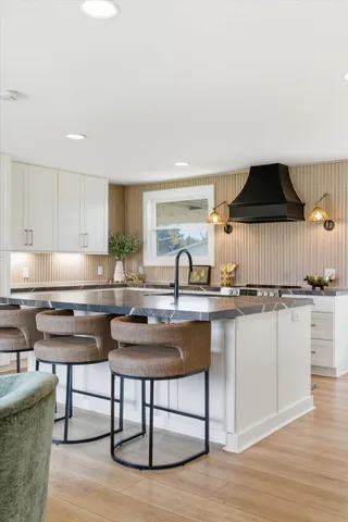 a kitchen with a sink cabinets and window