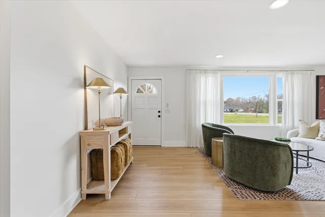 a view of a kitchen with a sink dishwasher and a fireplace