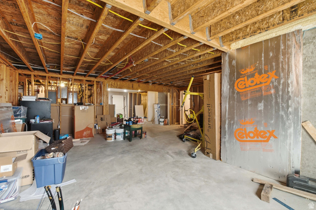 2567 West Rim Rock Drive Stockton, UT 84071 - Photo 42 of 64 Unfinished basement with exposed wood framing and concrete flooring