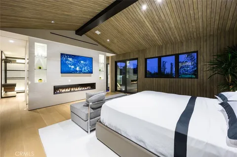 a spacious bathroom with a tub a double vanity sink a mirror and shower