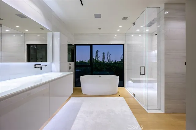 a large bathroom with a bathtub and a sink