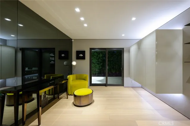 a room with furniture and potted plant