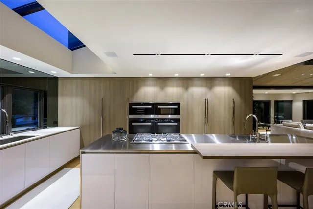 a kitchen with a sink and a refrigerator