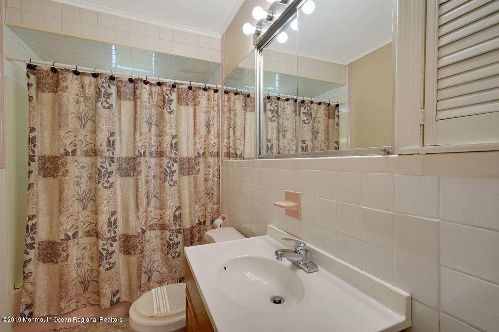798 Maplecrest Road Toms River, NJ 08753 - Photo 14 of 22 a bathroom with a sink toilet and shower