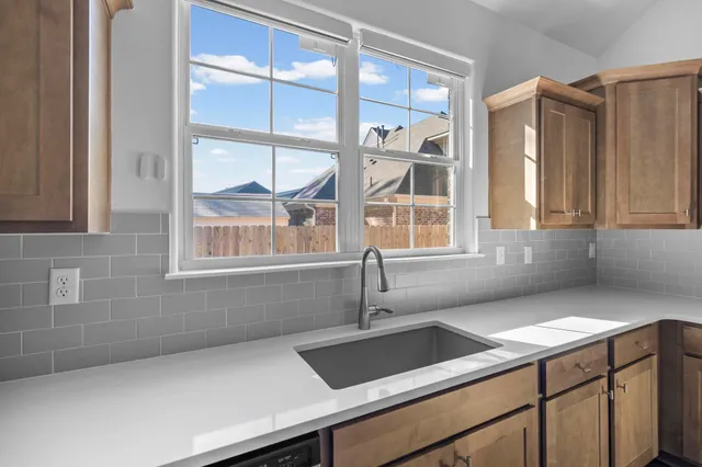 a view of a sink and a window