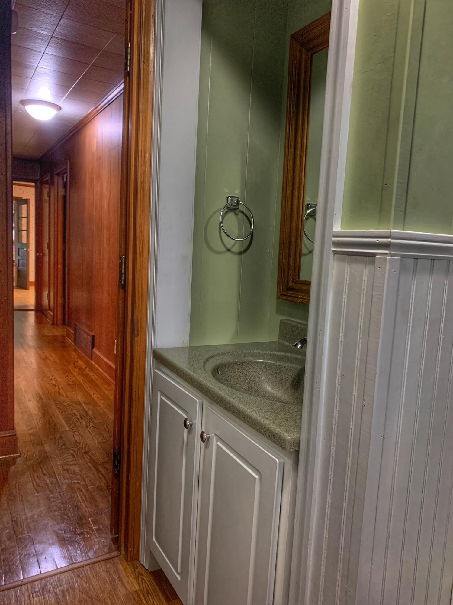5260 Haw Patch Road Ferrum, VA 24088 - Photo 21 of 46 a bathroom with a granite countertop sink and a mirror