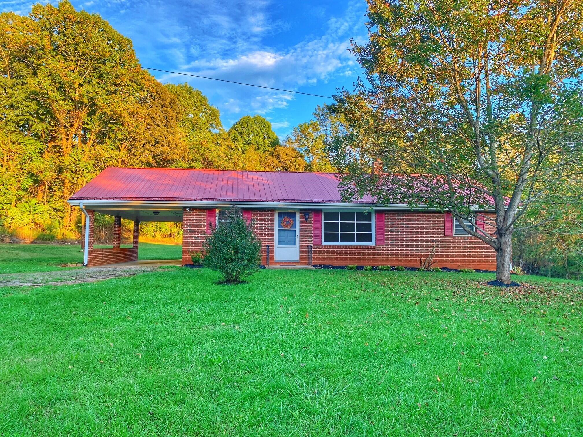 5260 Haw Patch Road Ferrum, VA 24088 - Photo 4 of 46 a front view of a house with garden