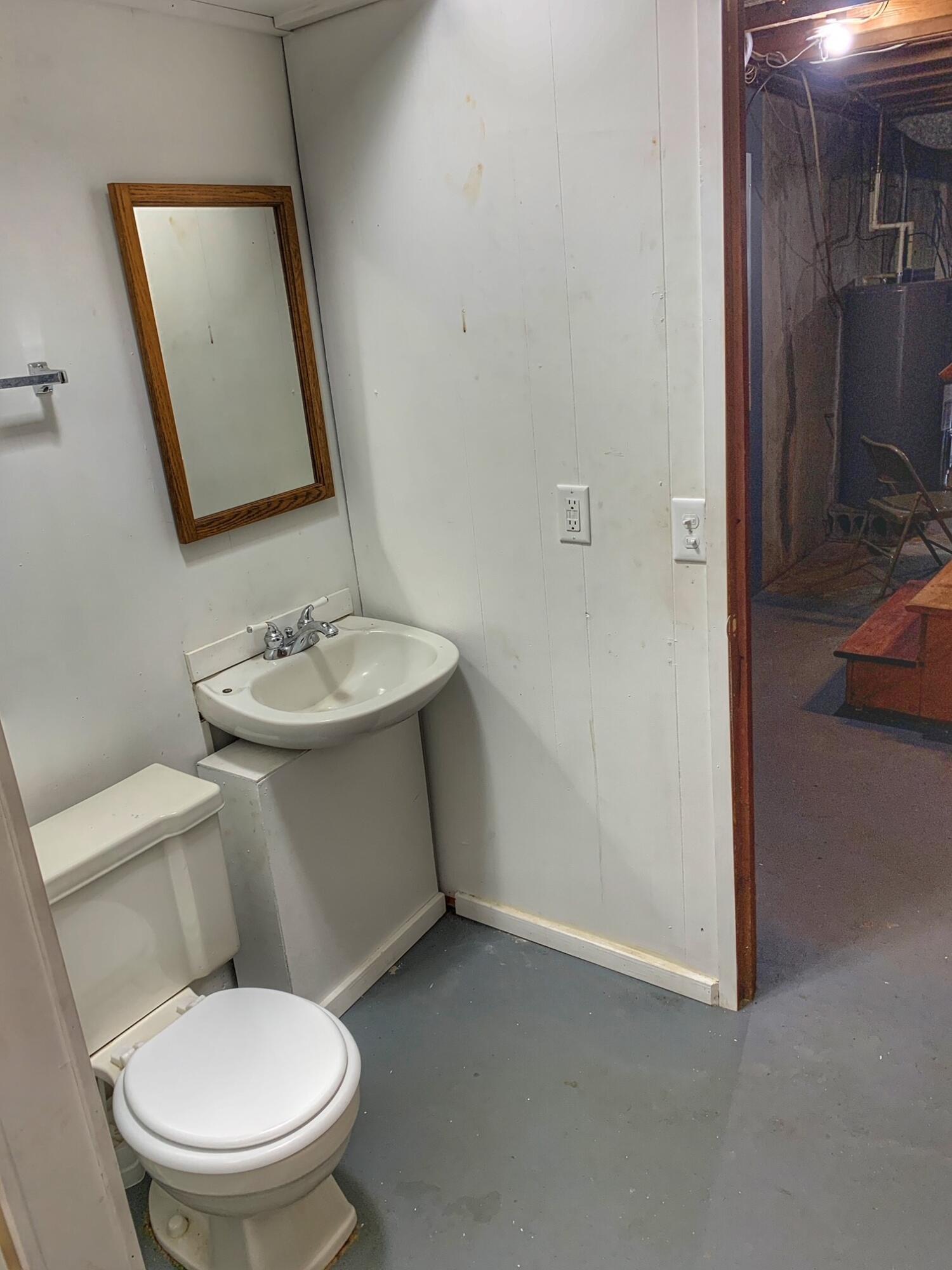 5260 Haw Patch Road Ferrum, VA 24088 - Photo 36 of 46 a white toilet sitting next to a bathroom sink