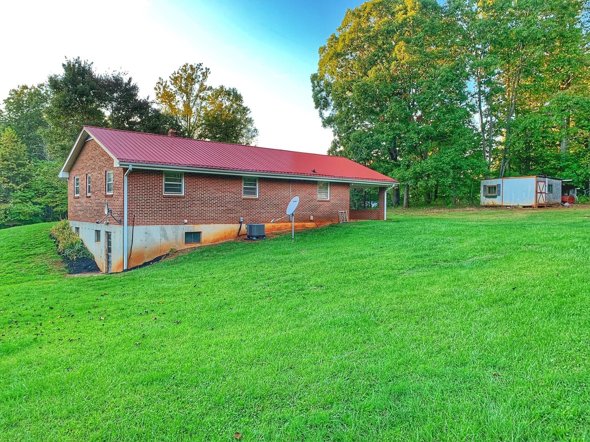 5260 Haw Patch Road Ferrum, VA 24088 - Photo 7 of 46 a view of a house with a yard