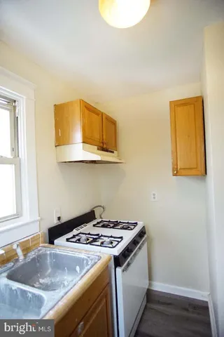 a kitchen that has a sink and a stove