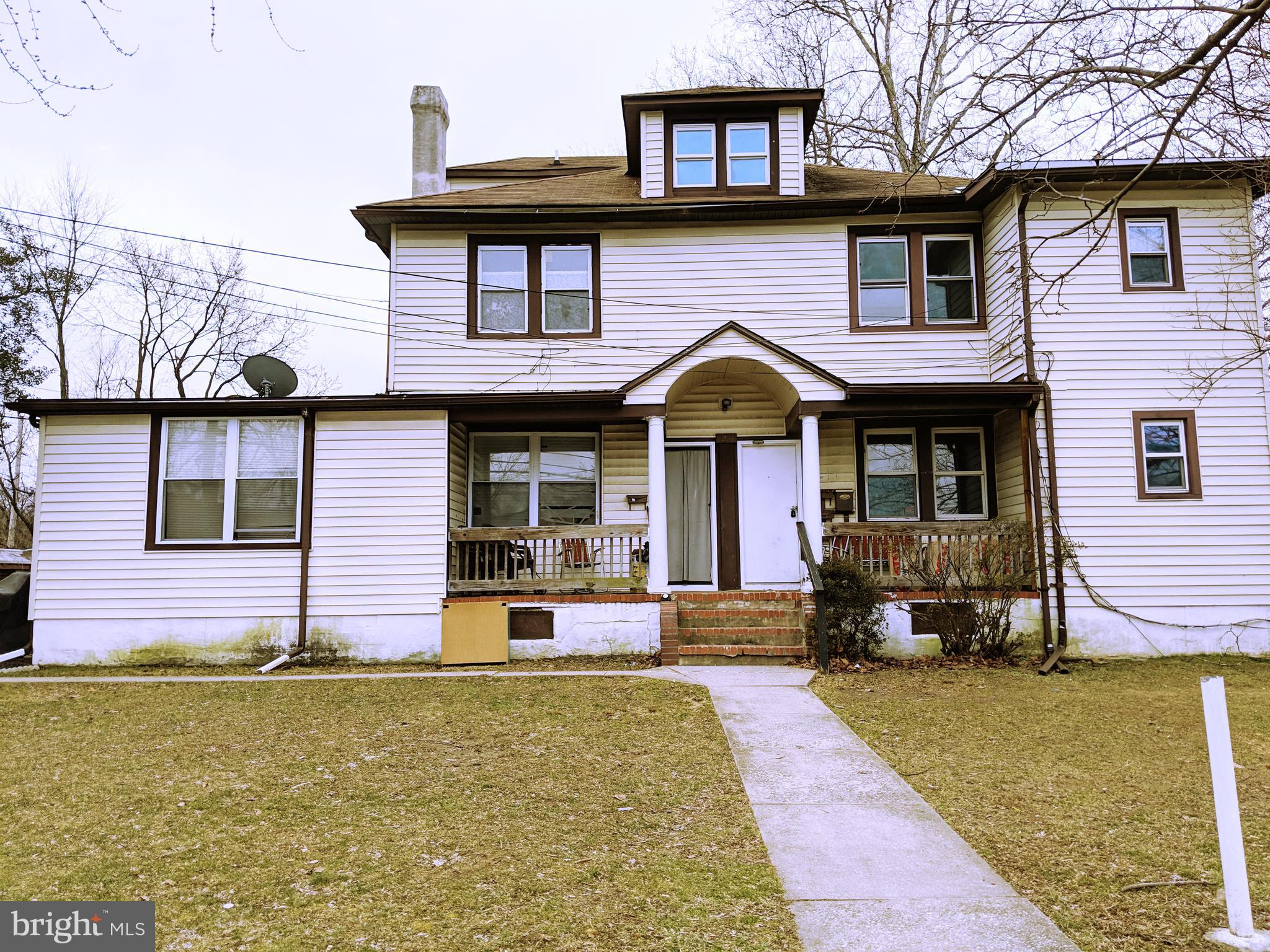 5200 Ballman Avenue, Unit 3 Baltimore, MD 21225 - Photo 17 of 17 a front view of a house having yard