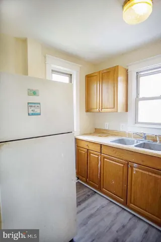 a white refrigerator freezer sitting inside of a kitchen
