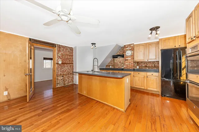 a white toilet sitting next to a bathroom sink