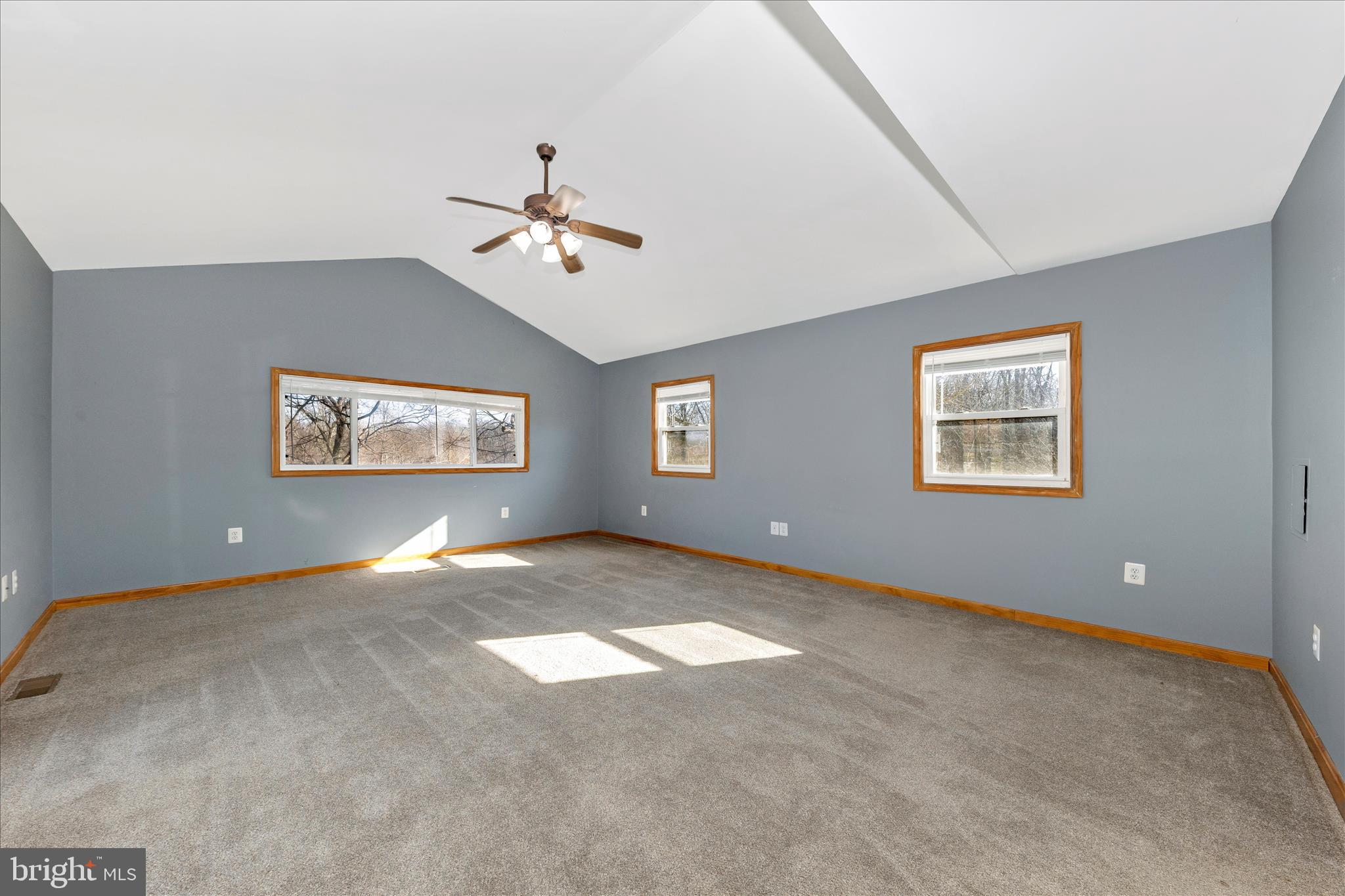 8204 Ball Road Frederick, MD 21704 - Photo 17 of 55 a view of a big room with ceiling fan and windows