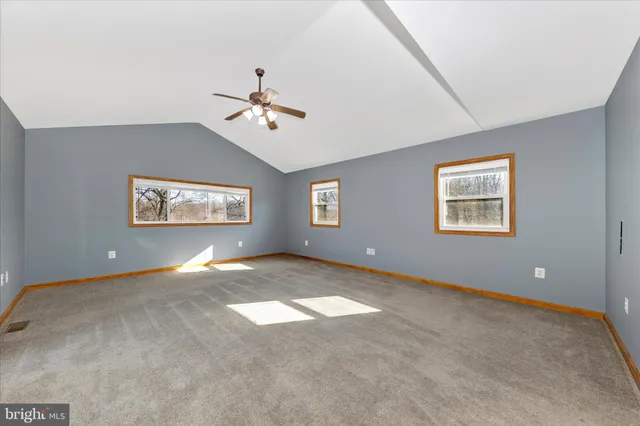 a bathroom with a double vanity sink a toilet and a mirror