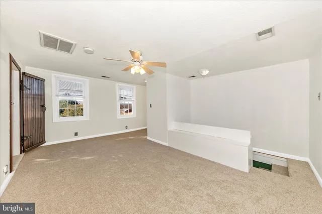 an empty room with windows