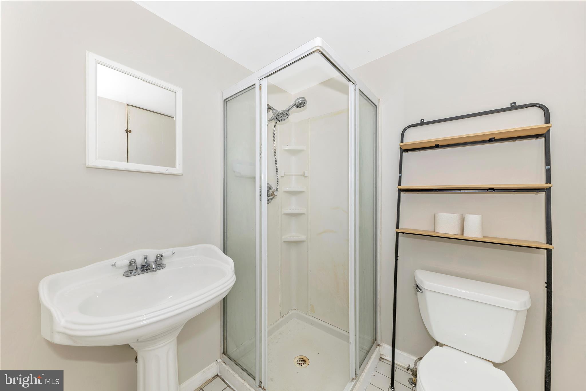 8204 Ball Road Frederick, MD 21704 - Photo 35 of 55 a bathroom with a shower a toilet and a sink