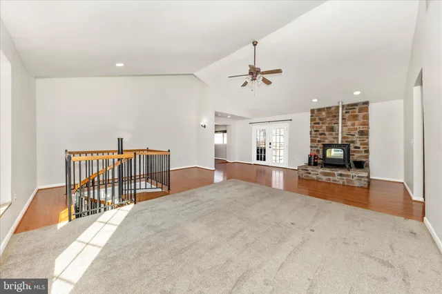 a view of a livingroom with hardwood floor and a ceiling fan