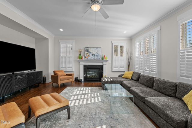 a bedroom with furniture and a ceiling fan