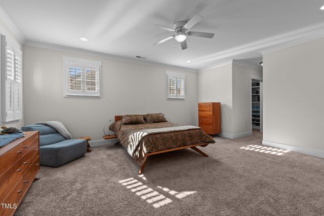 a spacious bathroom with a granite countertop tub sink shower and mirror
