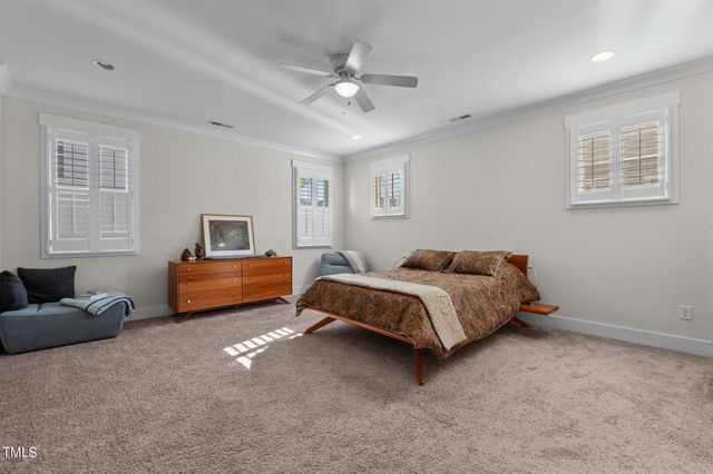 a white bath tub sitting next to a window