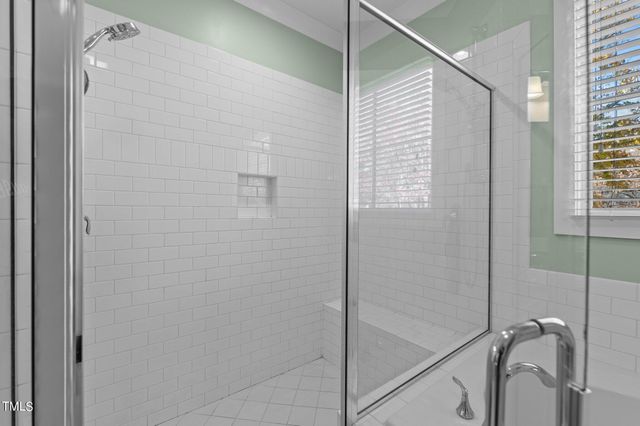 a bathroom with a double vanity sink mirror and toilet