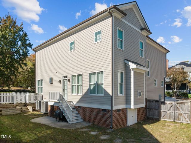 a view of a livingroom with furniture and a large window
