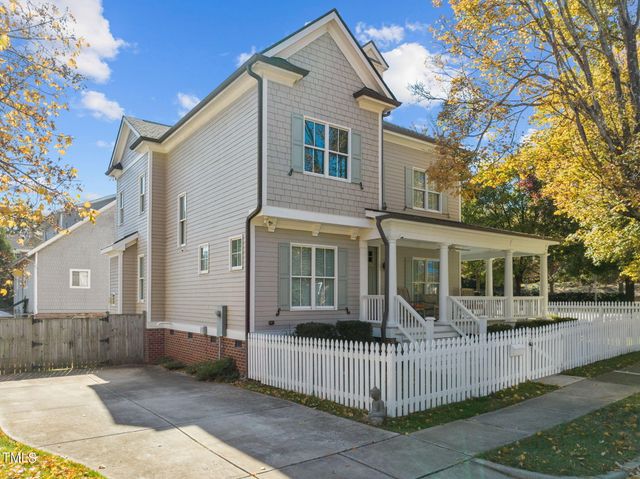 a view of a porch with furniture and wooden floor