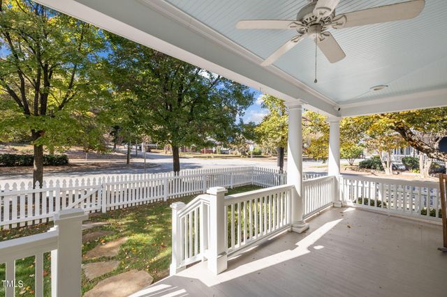 a group of people sitting in front of a building