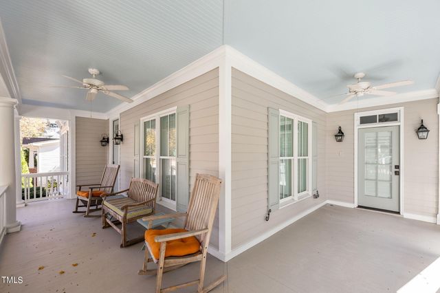 a front view of a building with a garden