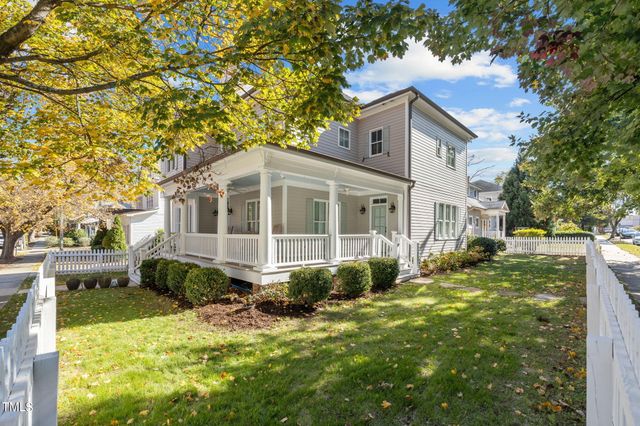 a front view of a house with a large window
