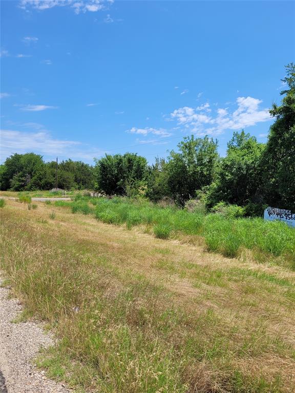 1175 Southwest Loop 286 Paris, TX 75460 - Photo 6 of 6 a view of a lake with a yard