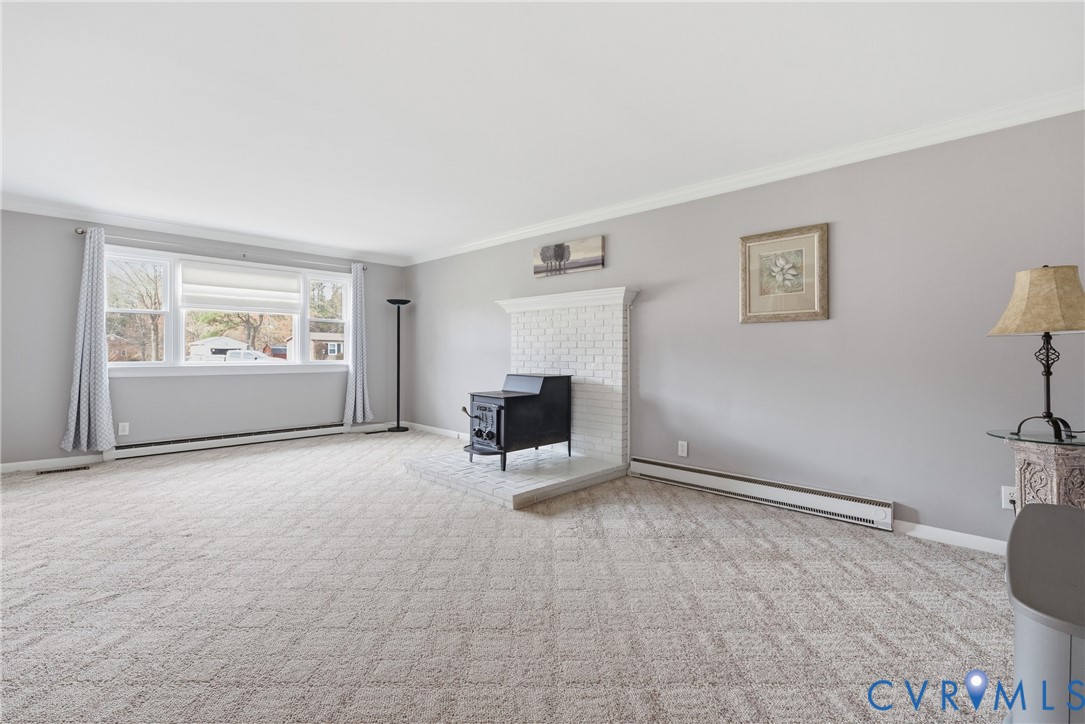 12298 Melton Road Ashland, VA 23005 - Photo 5 of 35 1st view of Spacious Family Room, carpet, and wood