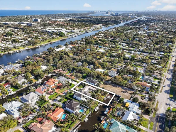 an aerial view of residential houses with yard