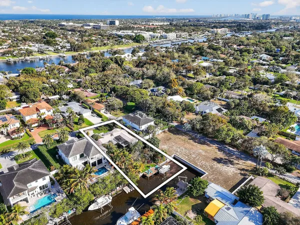 an aerial view of residential houses with city view