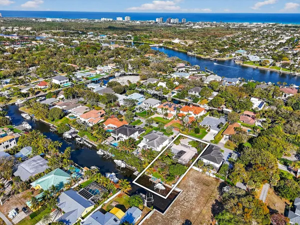 an aerial view of residential houses with city view